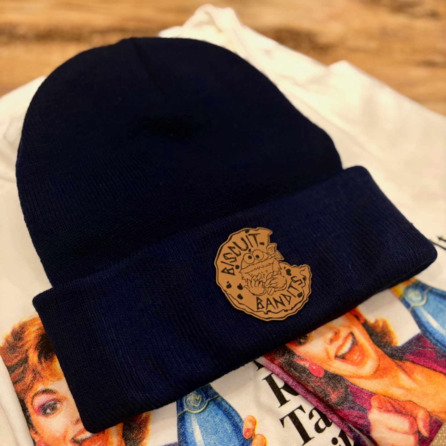 Product image of a v]navy blue beanie with the BBHC team logo on the fold